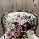 Reupholstered bergère with floral fabric in Louis XVI style.