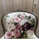 Reupholstered bergère with floral fabric in Louis XVI style.