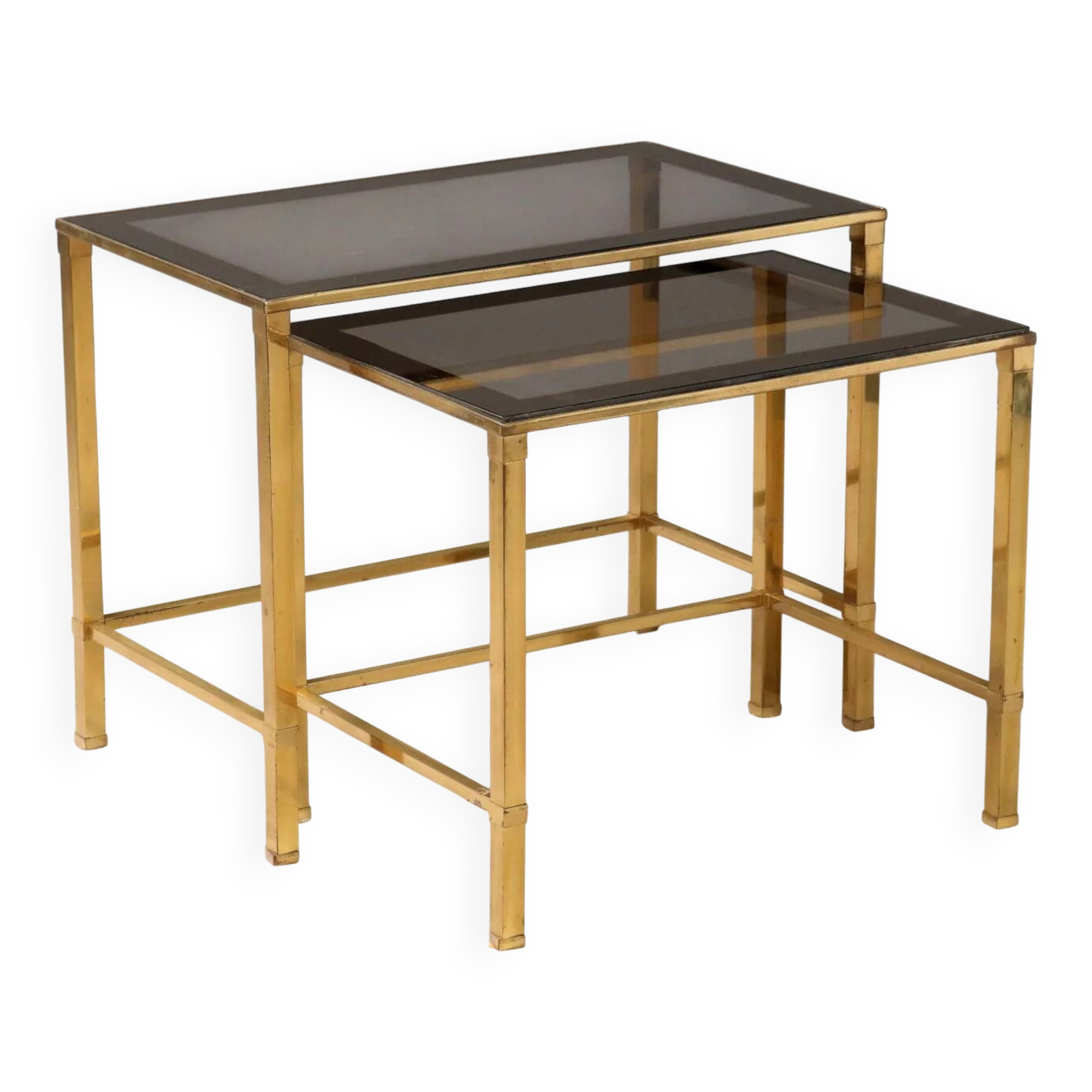 Nested tables in brass and smoked glass.