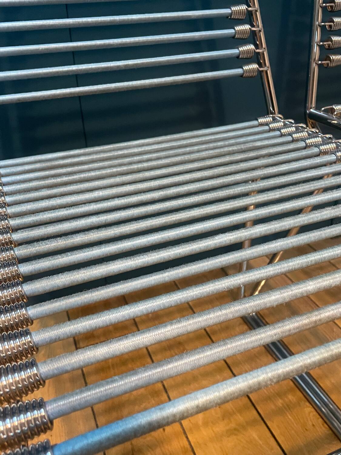 2 metal chairs with bungee cords