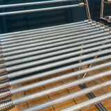 2 metal chairs with bungee cords
