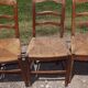 17 old straw chairs