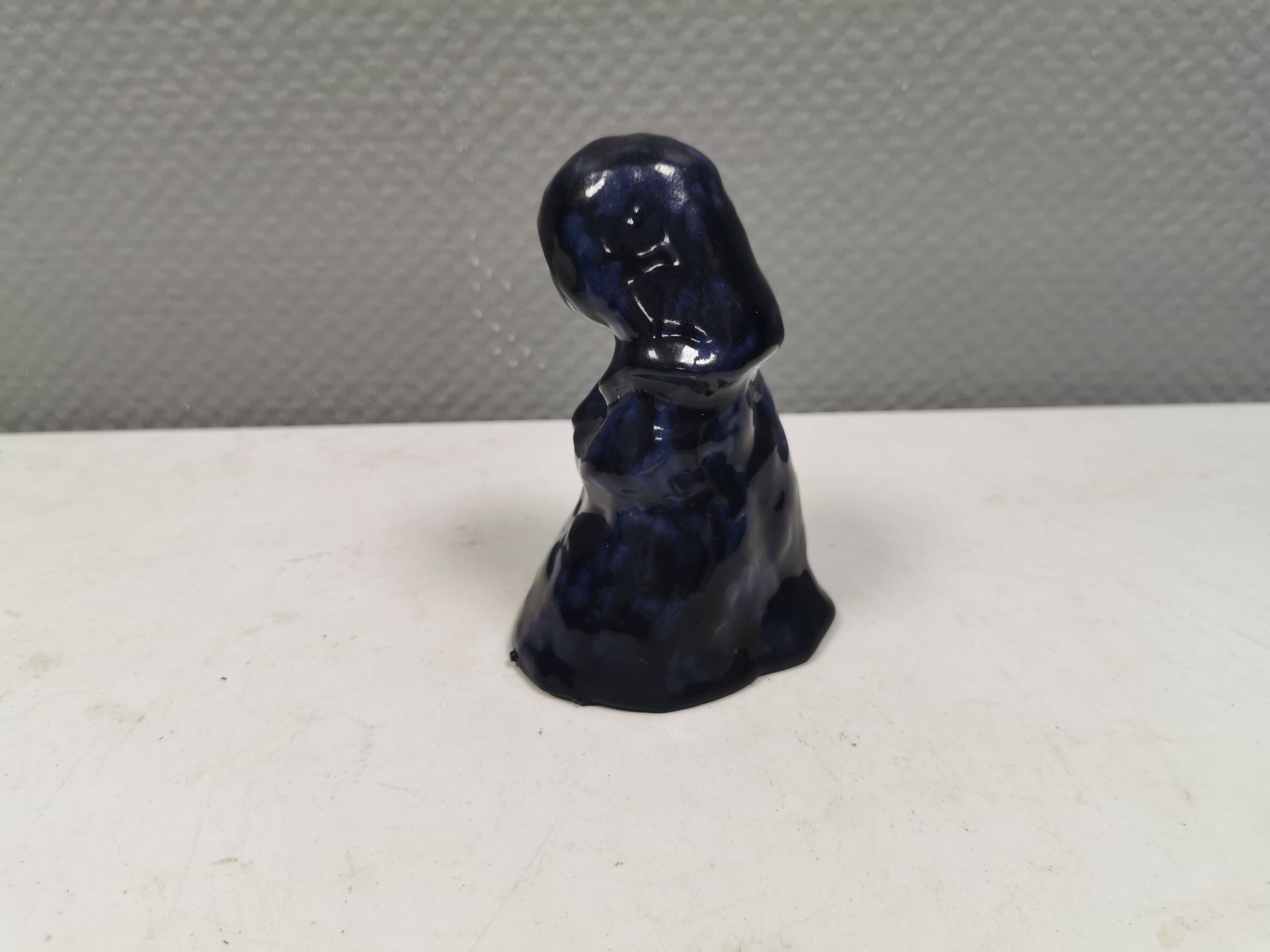 Lady figure in earthenware with shiny blue glaze