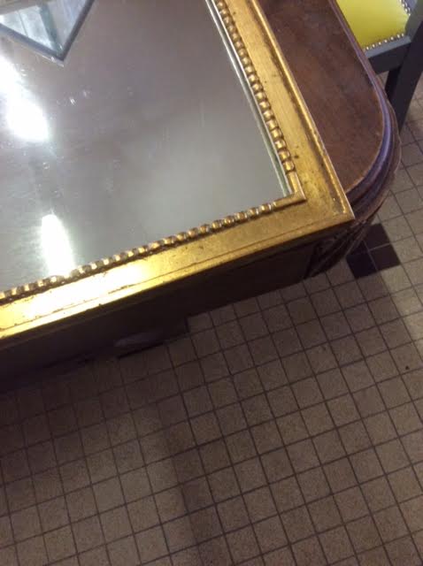 Wooden mirror and gilded stucco