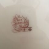 Flat old plates mismatched with flowers