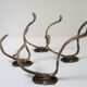 Four patères bronze patinated leafy décor early 20th century