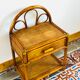 Pair of bamboo and rattan bedside tables