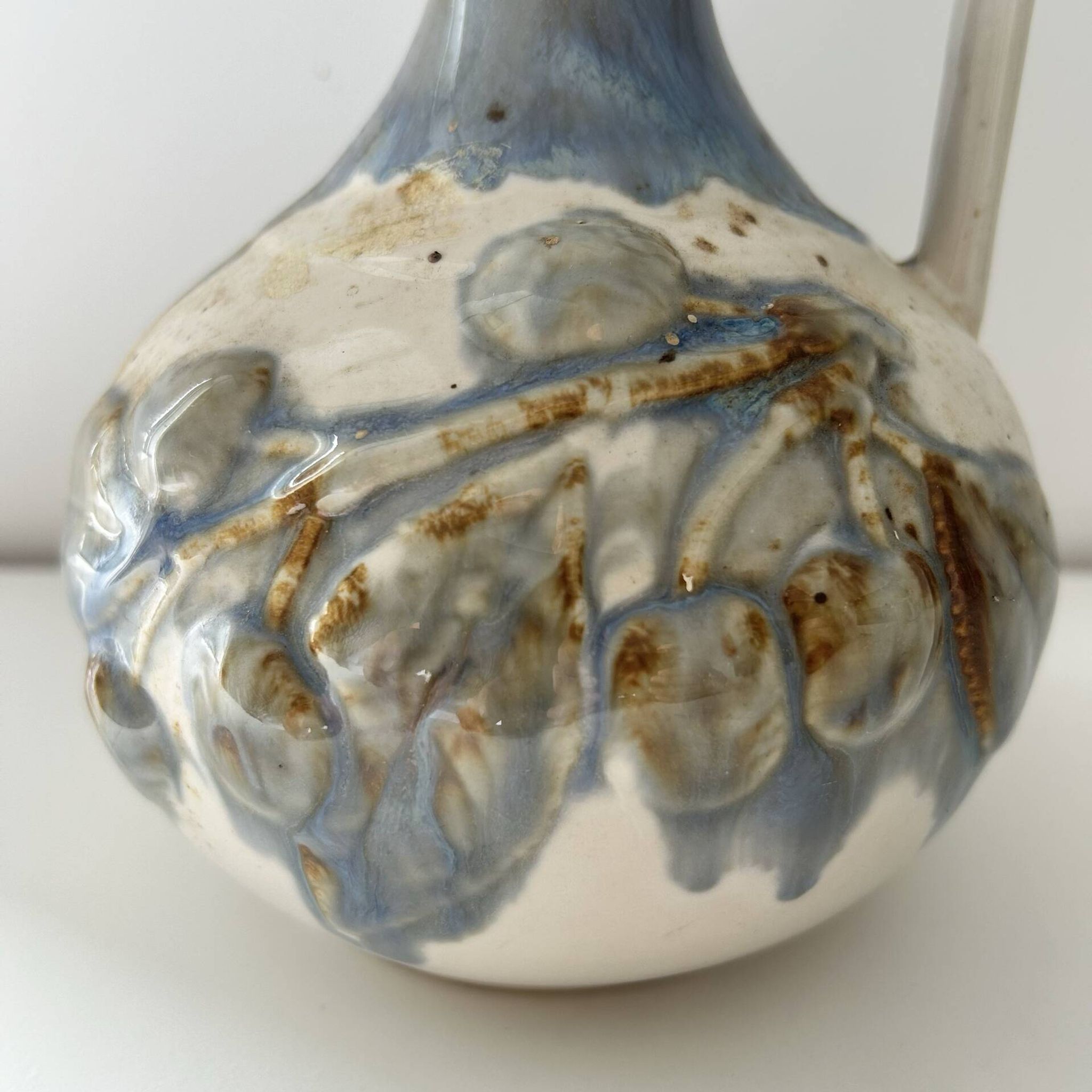 Cherry-decorated earthenware carafe