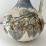 Cherry-decorated earthenware carafe