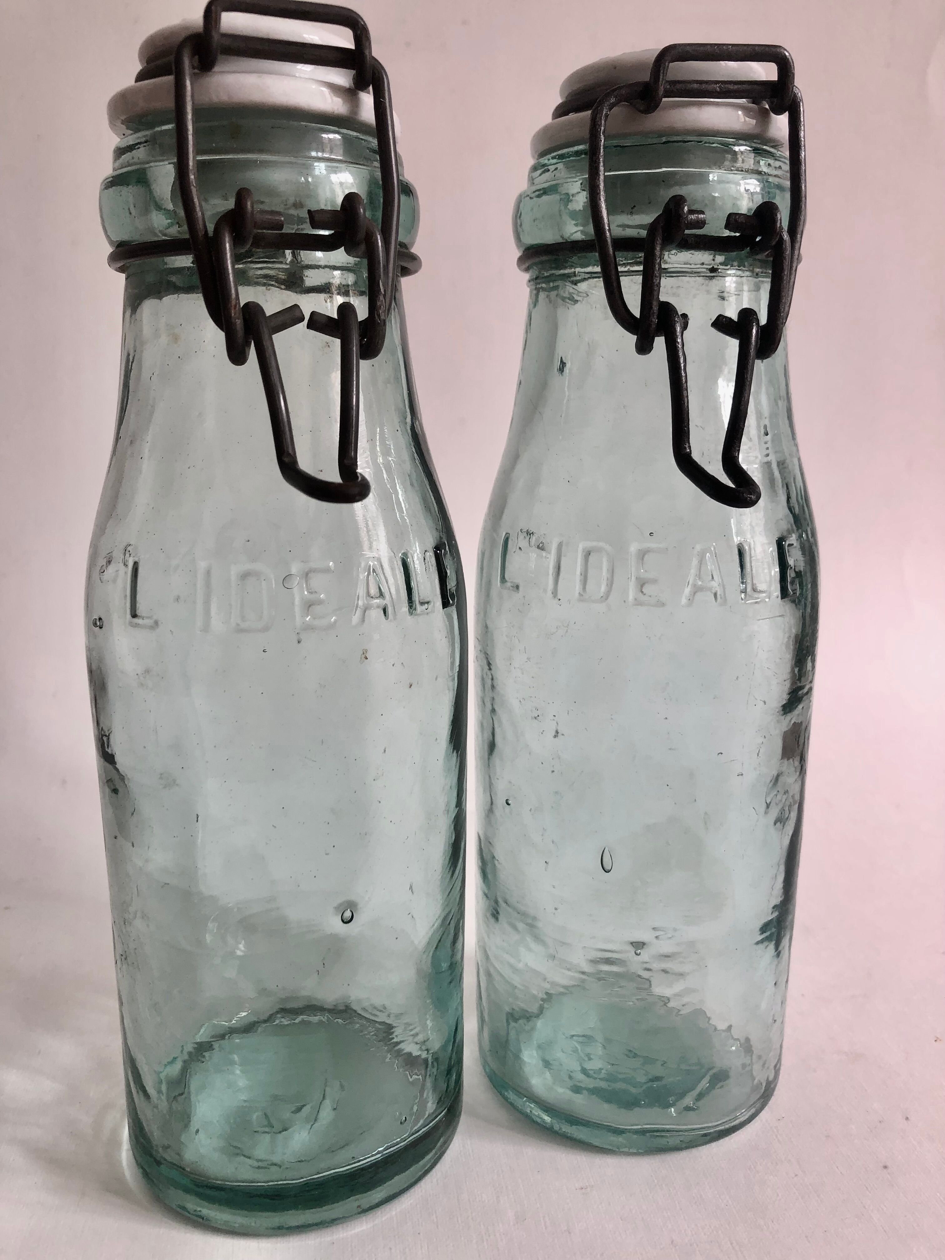 Two bottles with canned goods l'ideale