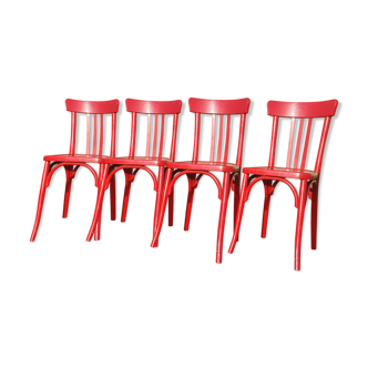Série de quatre chaises de bistrot 1950 rouge