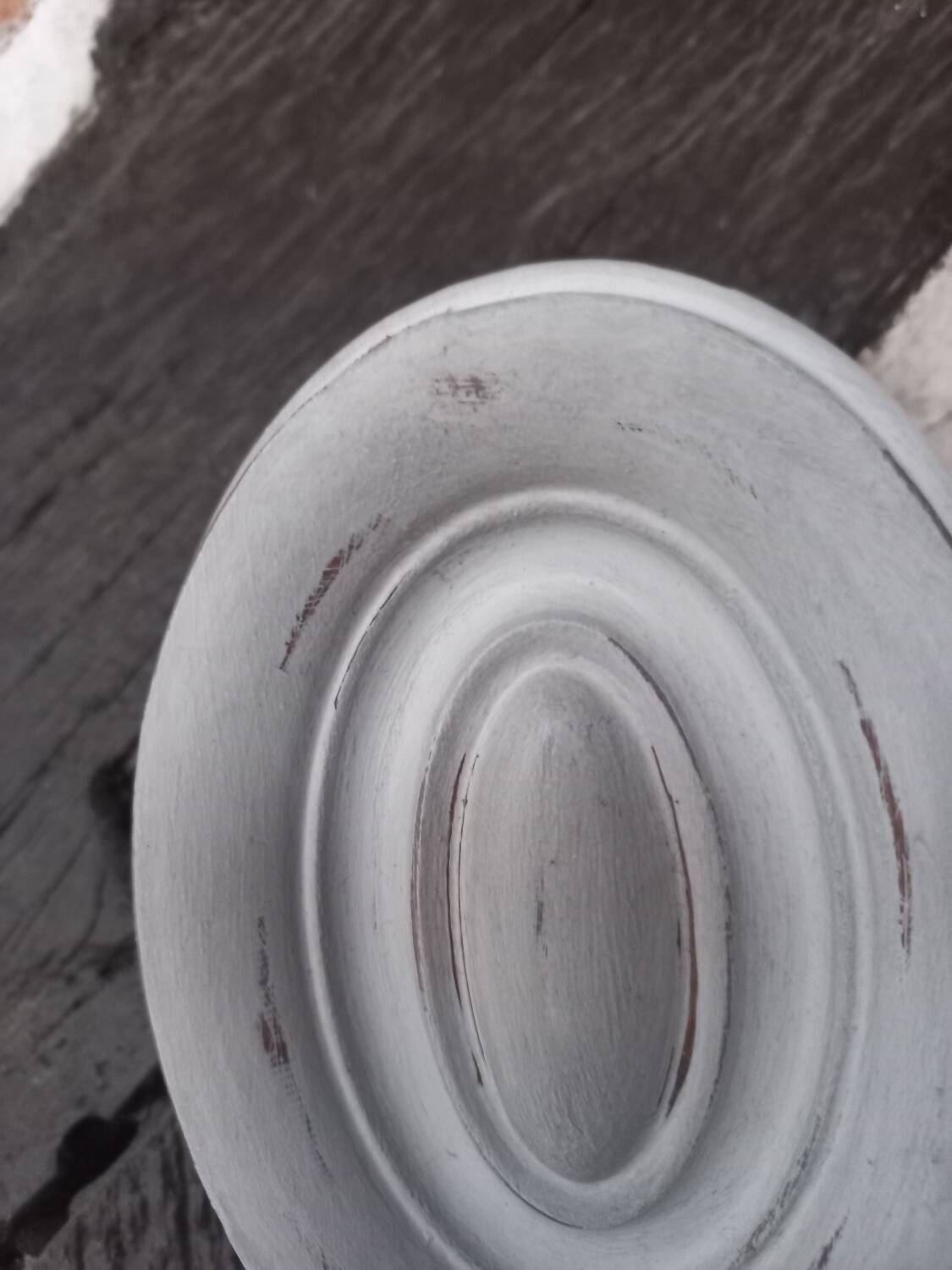 Pair of patinated oval woodwork