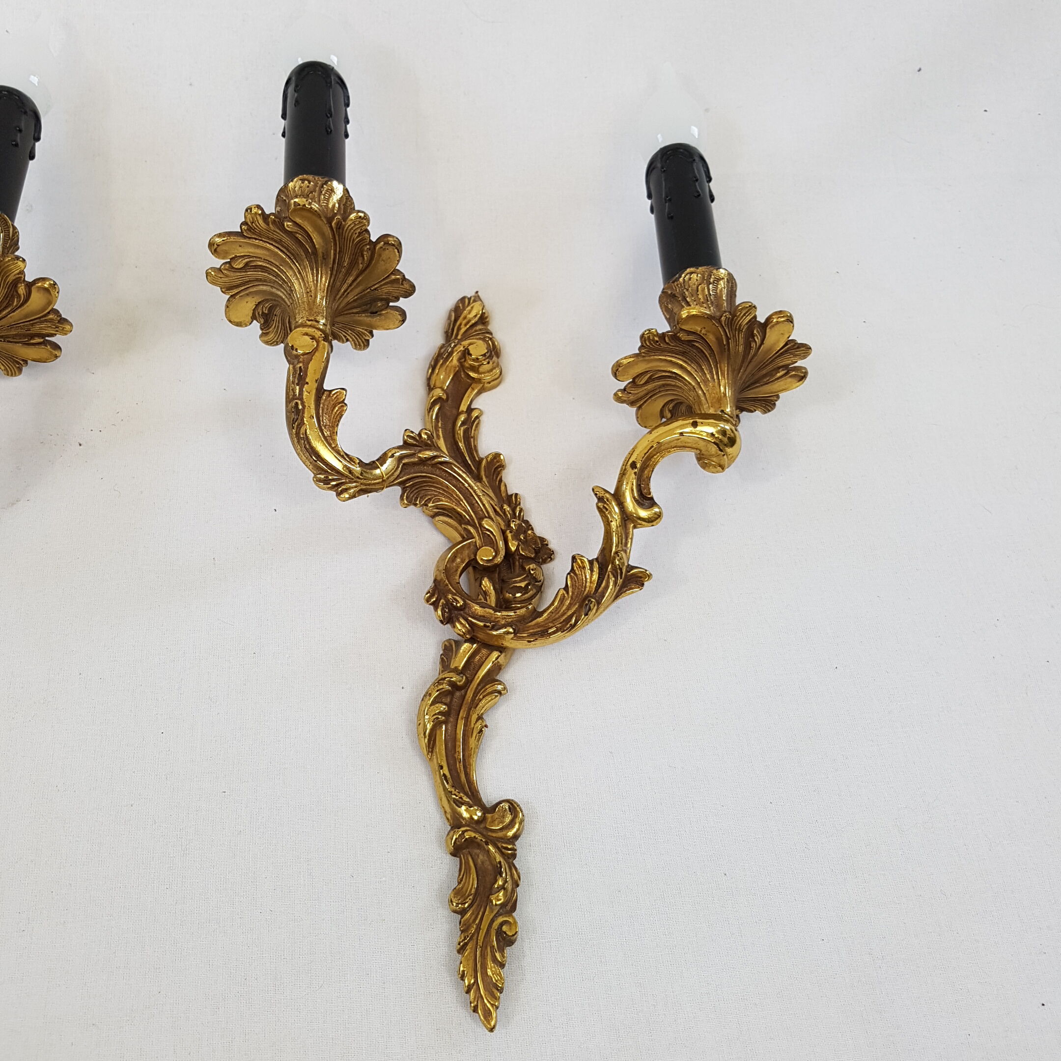 Pair of Louis XV style bronze wall lamps