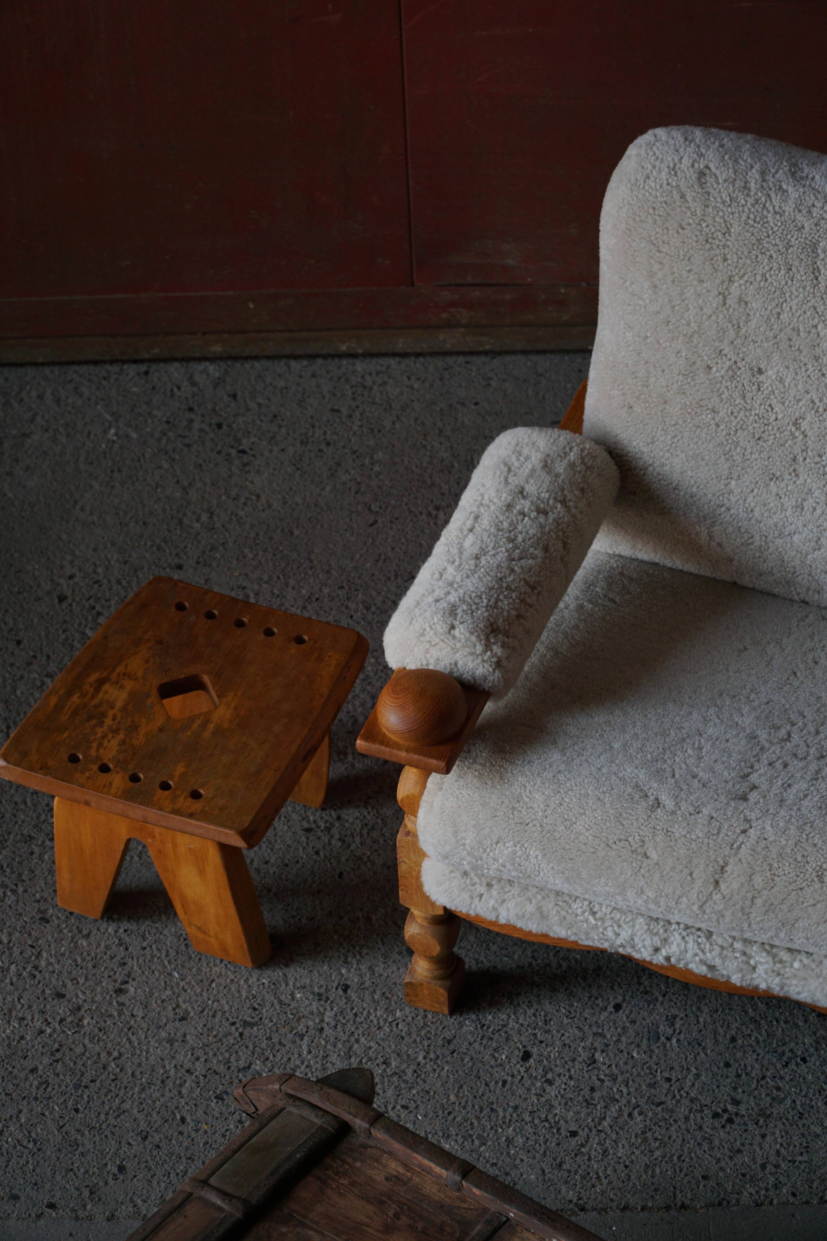 Henning Kjærnulf, lounge chairs in oak and lambswool, mid-century Danish, 1960s.