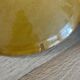 Set of 9 mustard earthenware plates.
