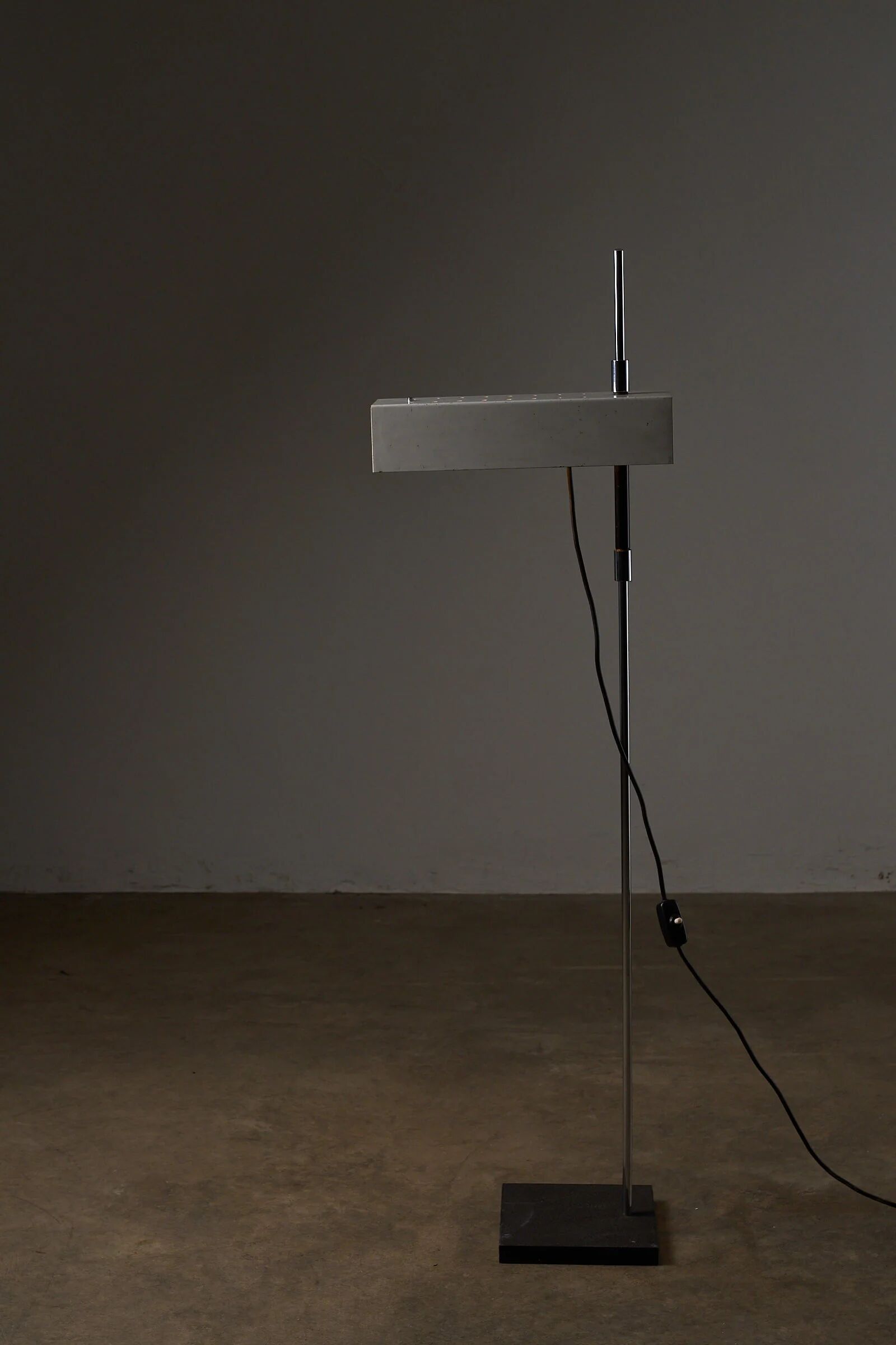 Adjustable perforated shade floor lamp