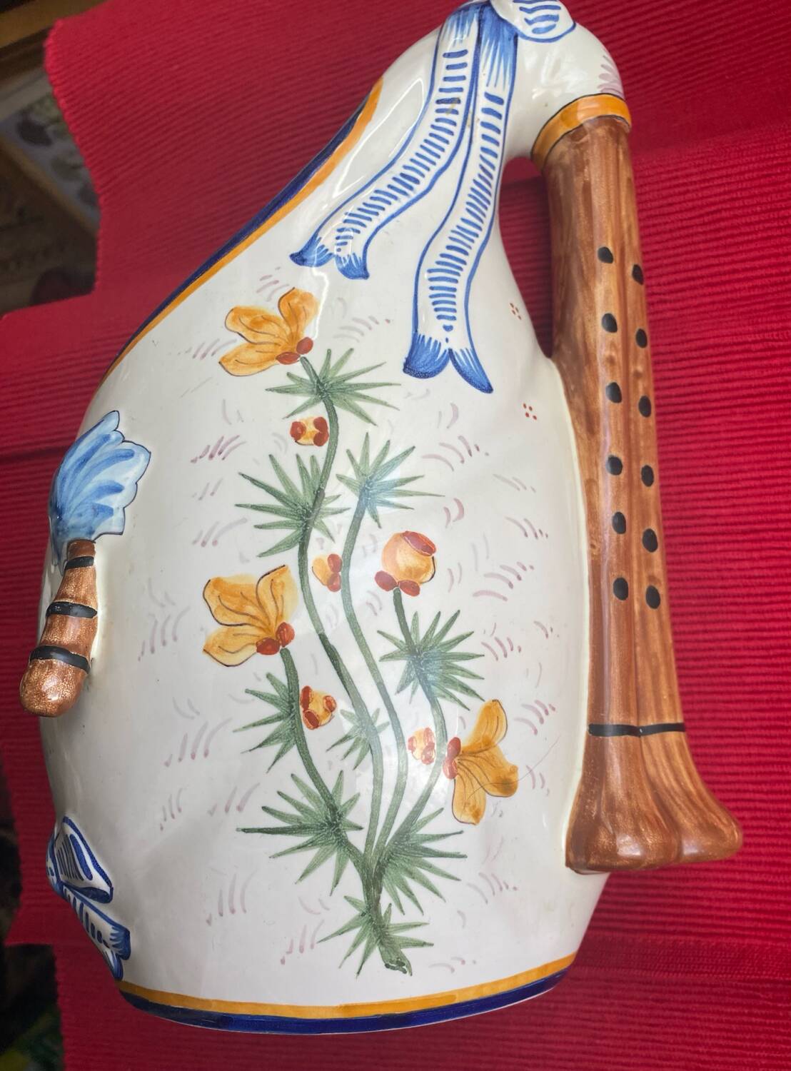 Quimper vase in the shape of a bagpipe, signed and numbered.