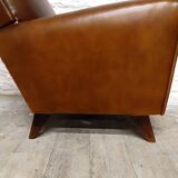 Antique club armchair from the 1950s with compass feet