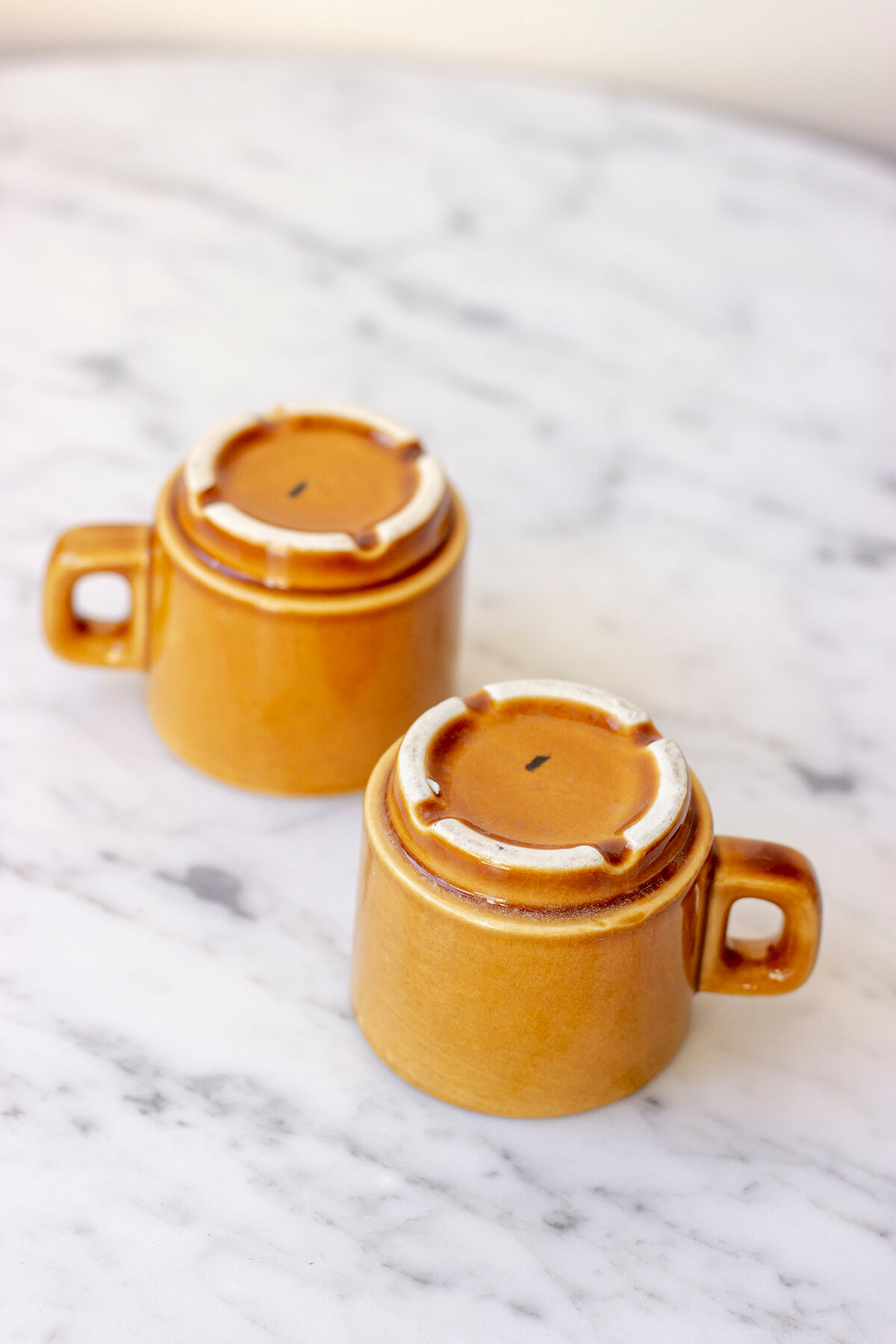 Pair of ochre yellow coffee cups