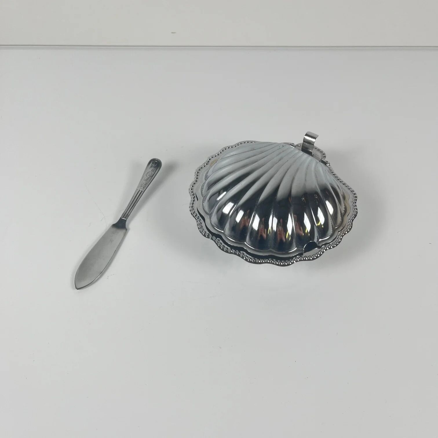 Metal shell butter dish with blue insert, 1970 with knife.