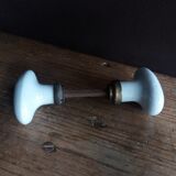 White porcelain door knob handles