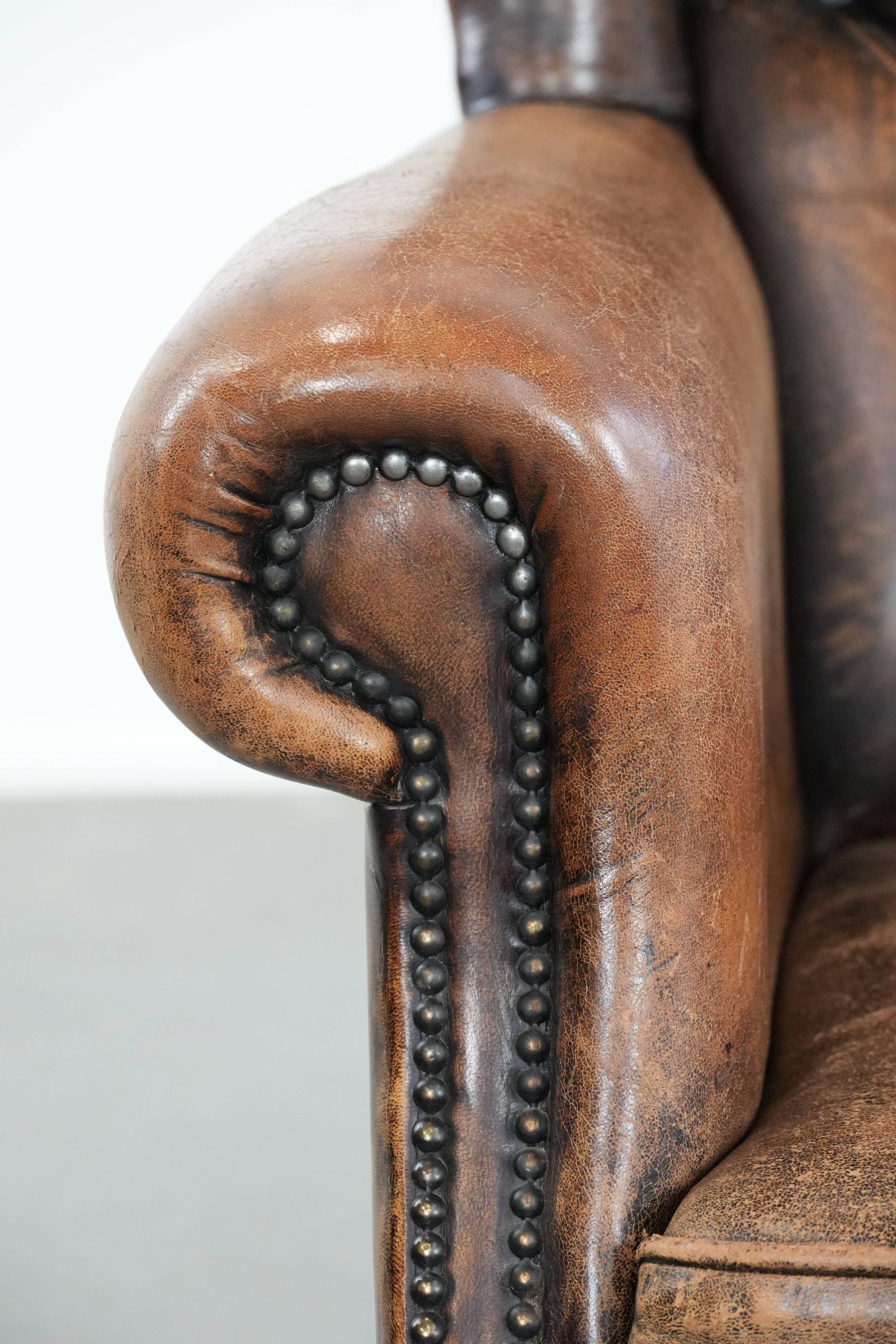 Unique large sheepskin Chesterfield wingback armchair in English style