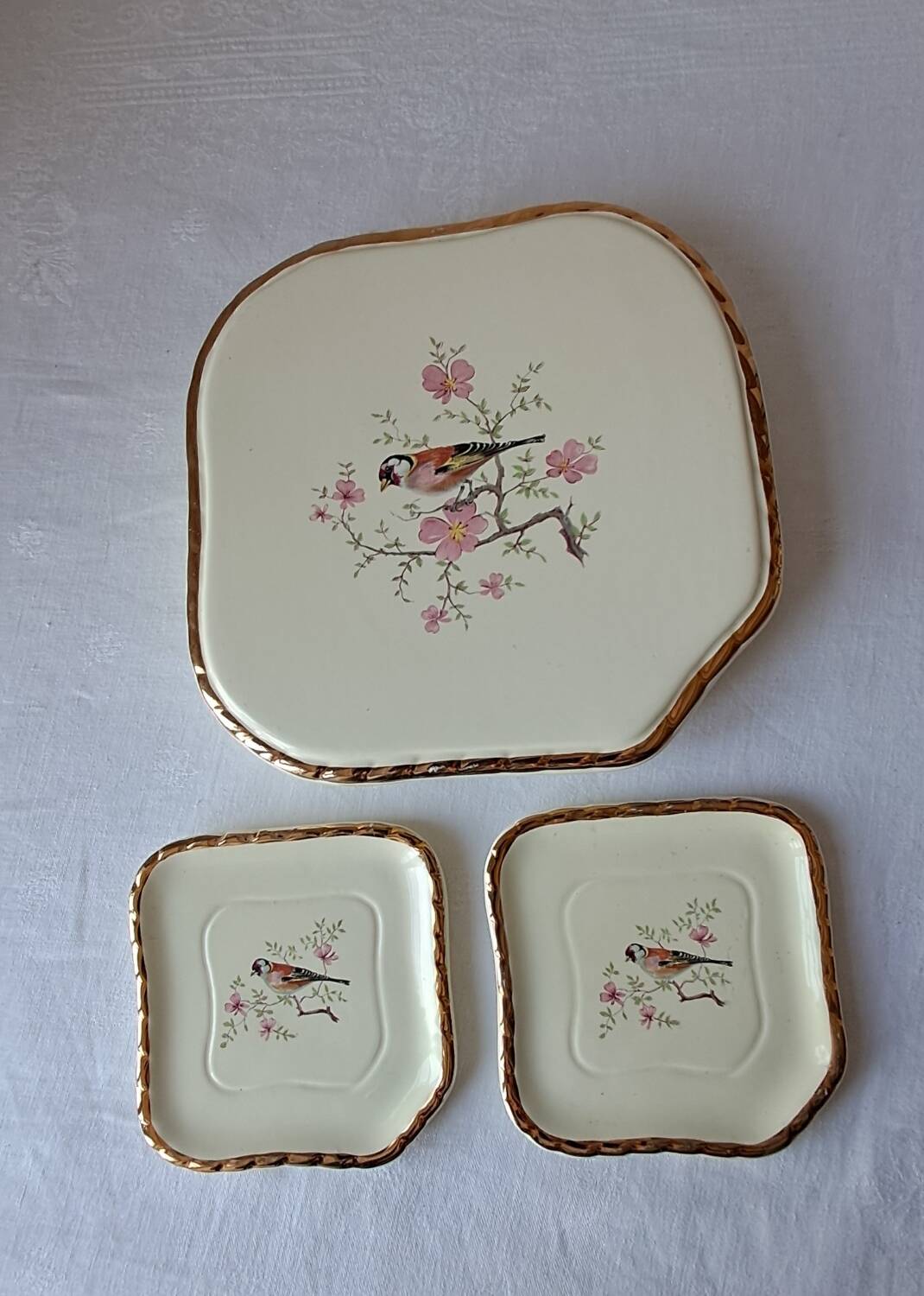 Trivet and bottle holder Salin, 1950s. Bird on branch.