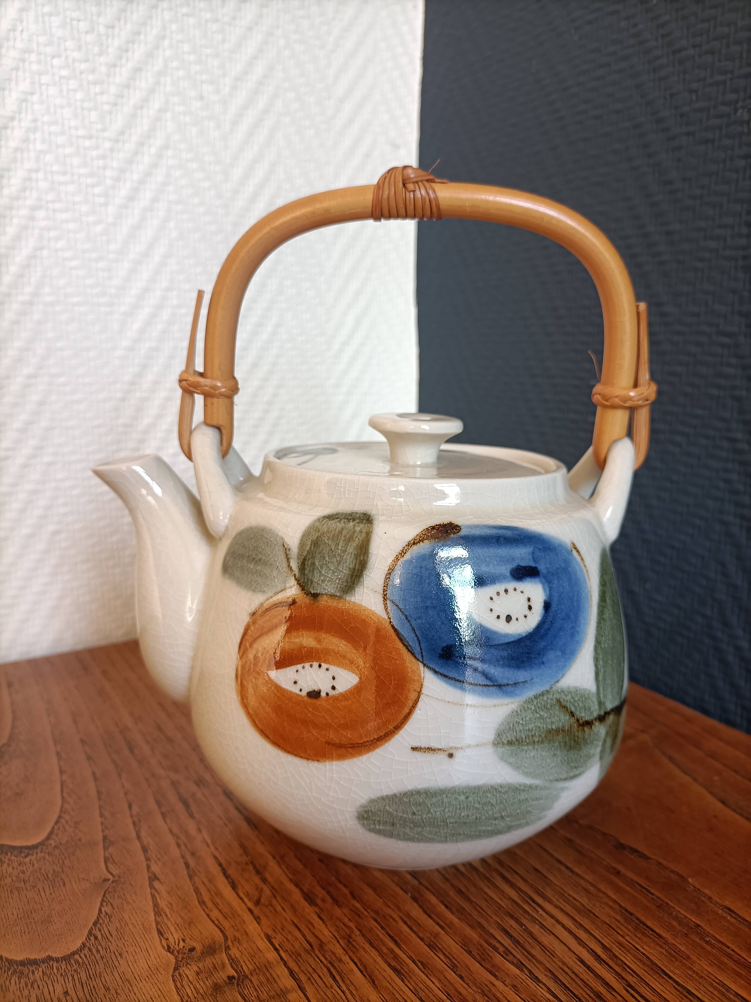 Asian style teapot with bamboo handle