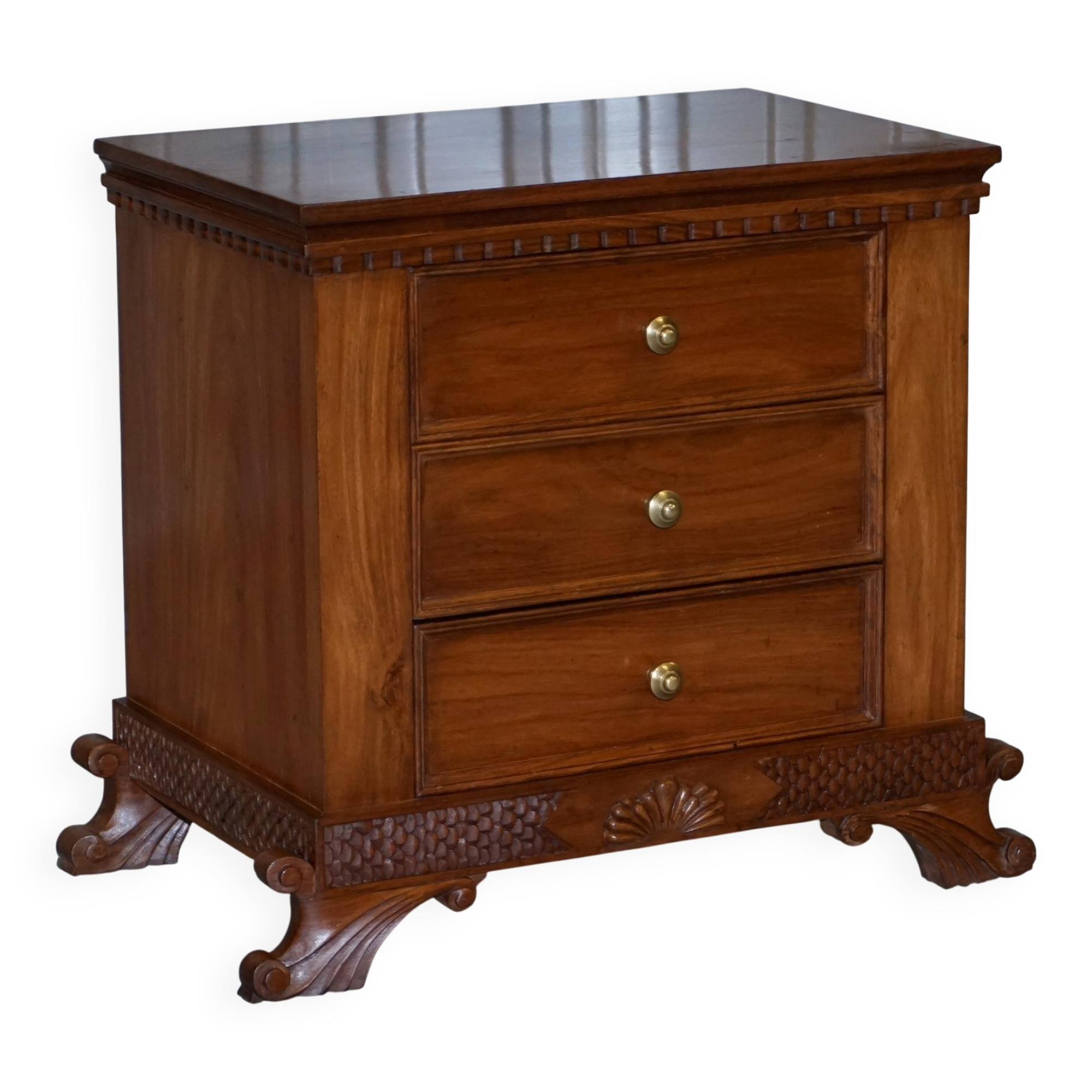Set of hardwood dressers with finely carved bases.