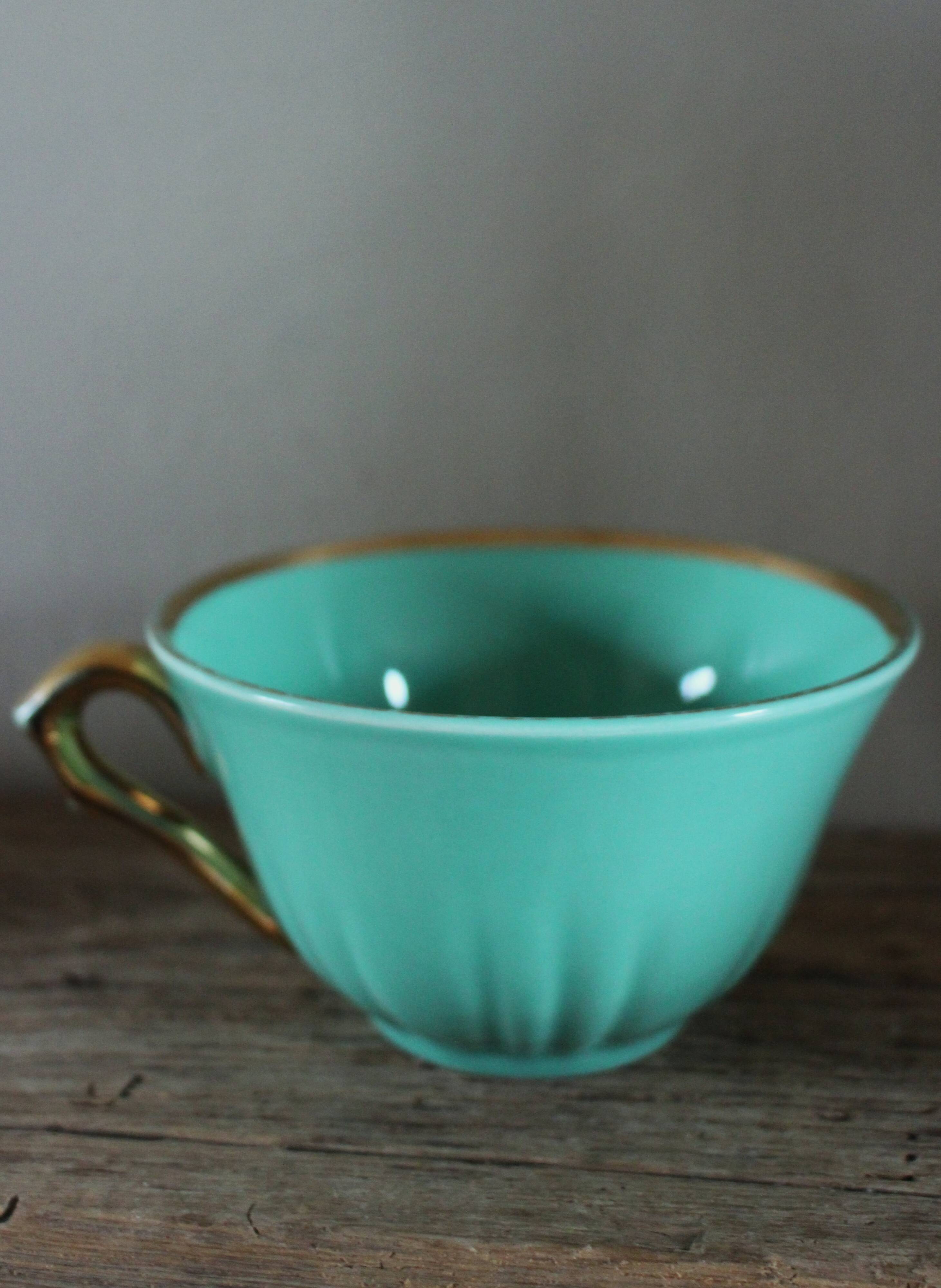 Green and gold cup from the Moi Salins collection.