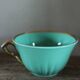 Green and gold cup from the Moi Salins collection.