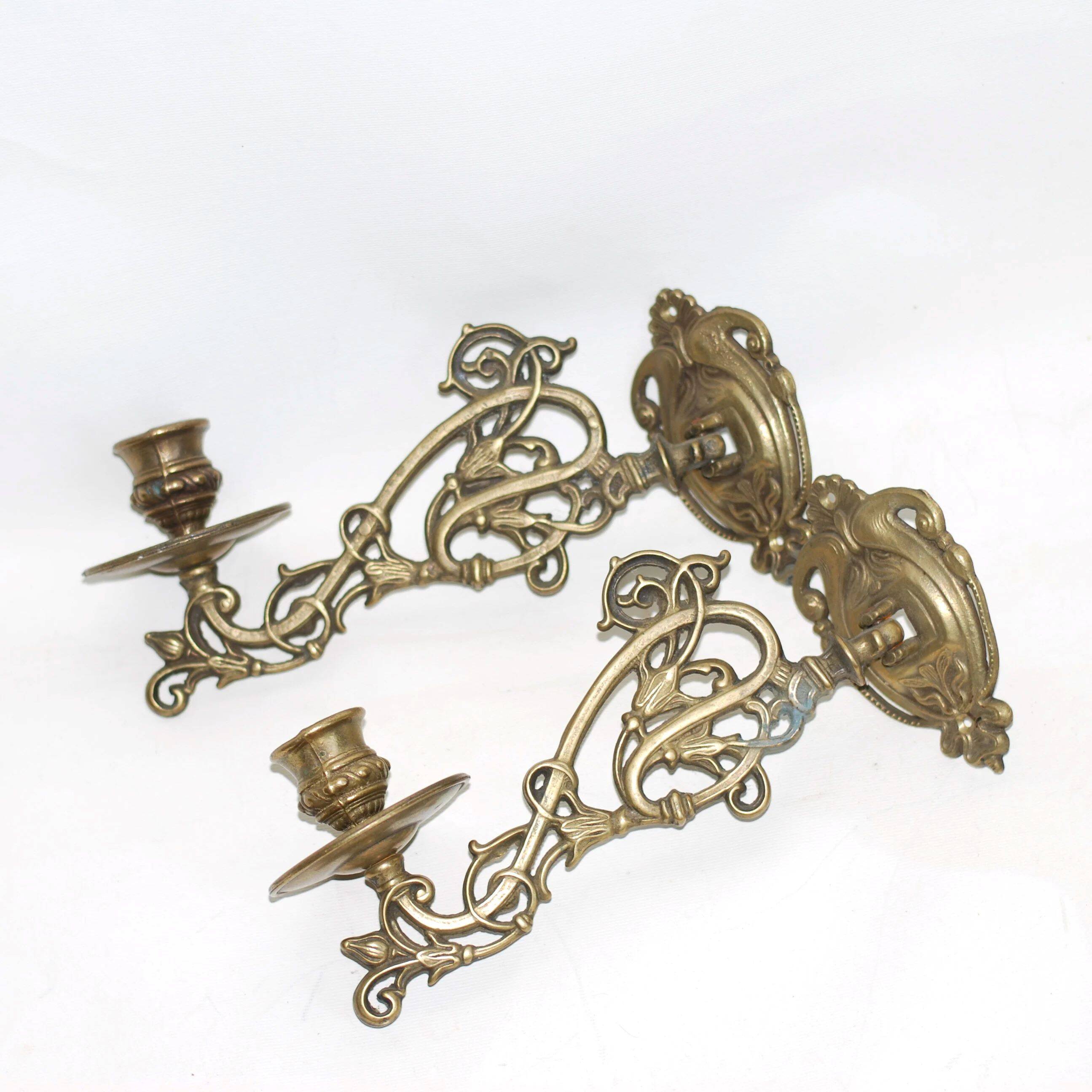 Pair of wall candle holders in brass