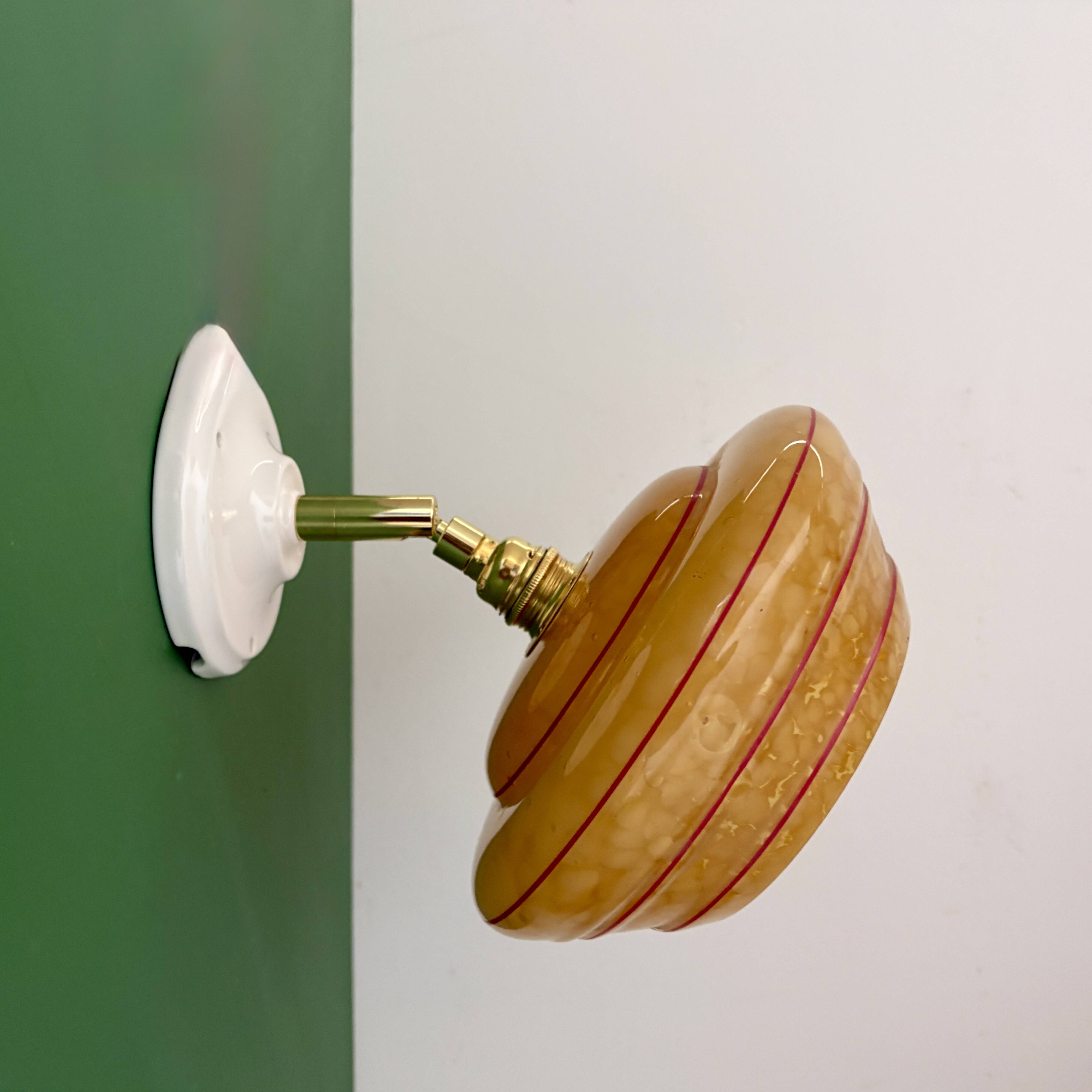 Vintage wall lamp with yellow clichy glass shade and red trim