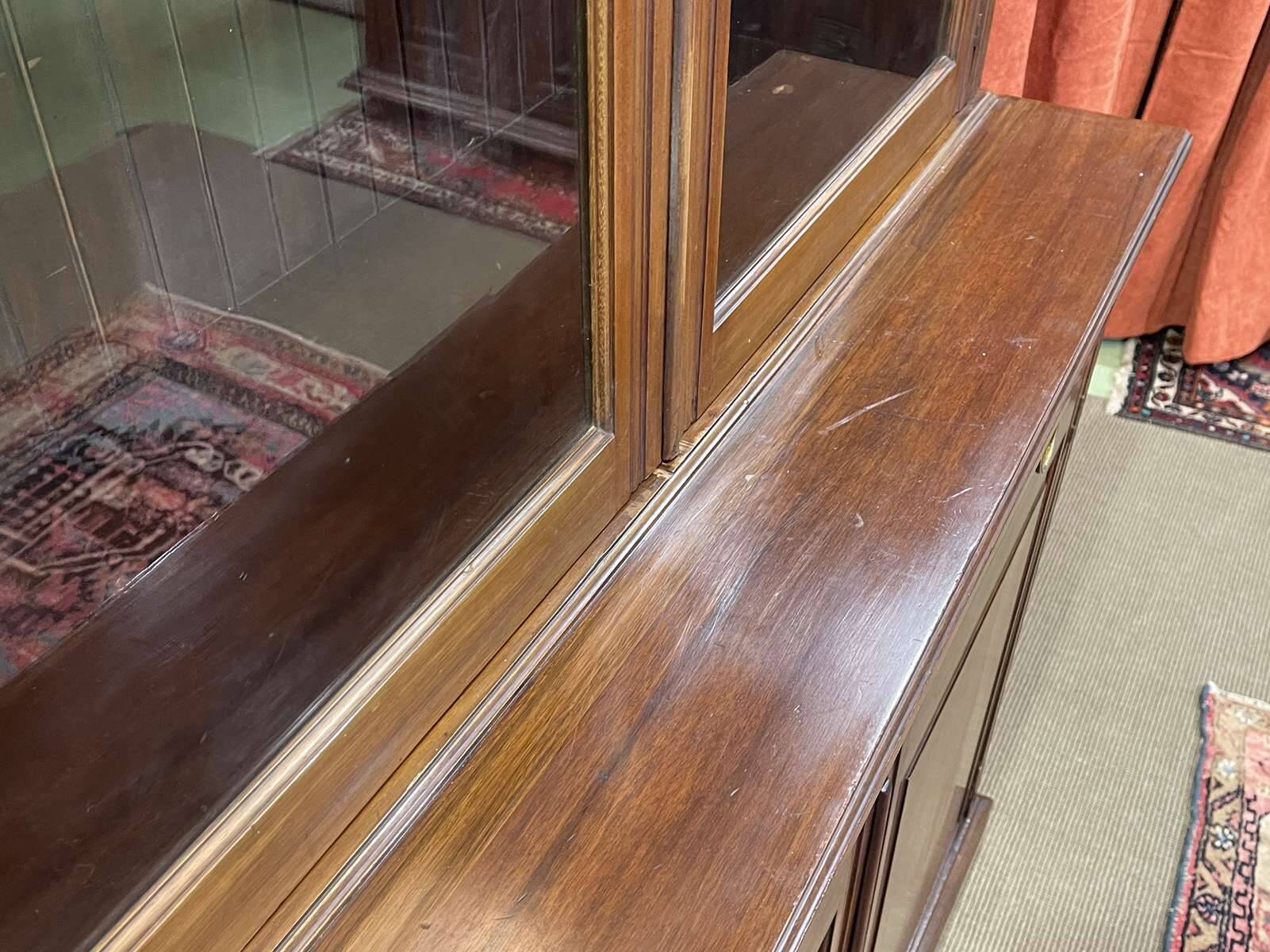 English walnut two-body library from the early 20th century.