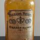 Lot d'anciens flacons de parfumeurs en verre avec étiquettes d'origine