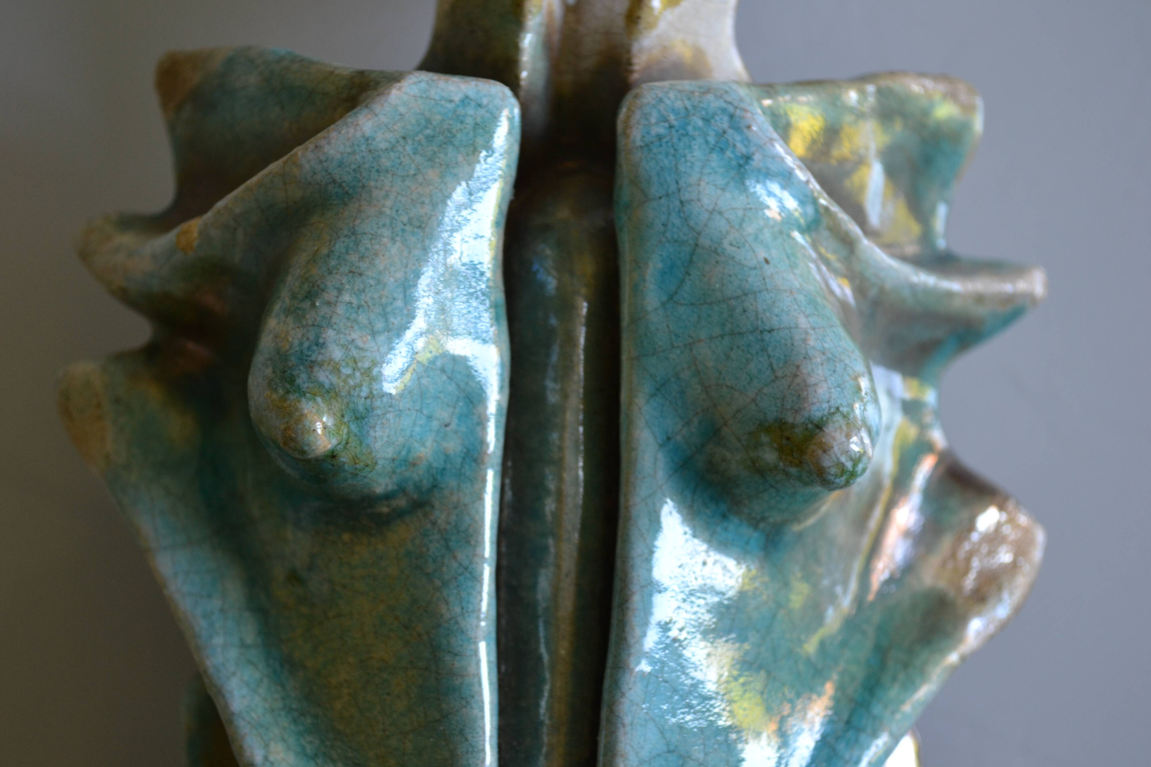 Surreal ceramic sculpture in relief signed to be identified.
