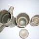High coffee or teapot and 4 cups in sandstone