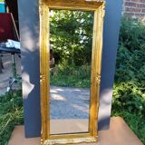 narrow gilded mirror in Louis XV style