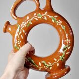 Circular glazed terracotta gargoulette