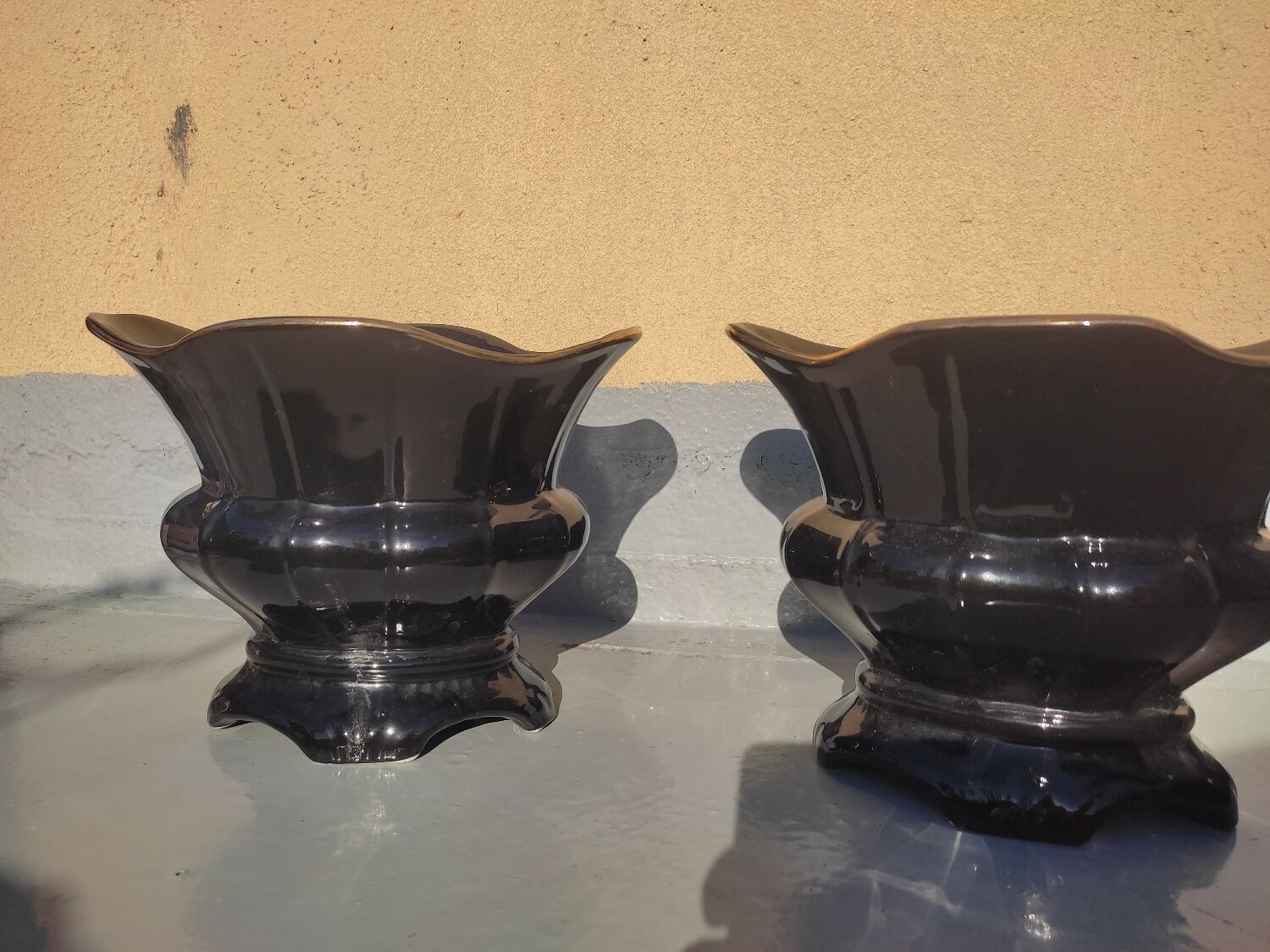 Pair of black earthenware planters