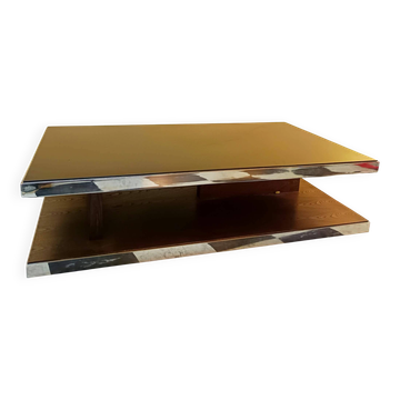 Designer coffee table in glass and chrome metal.