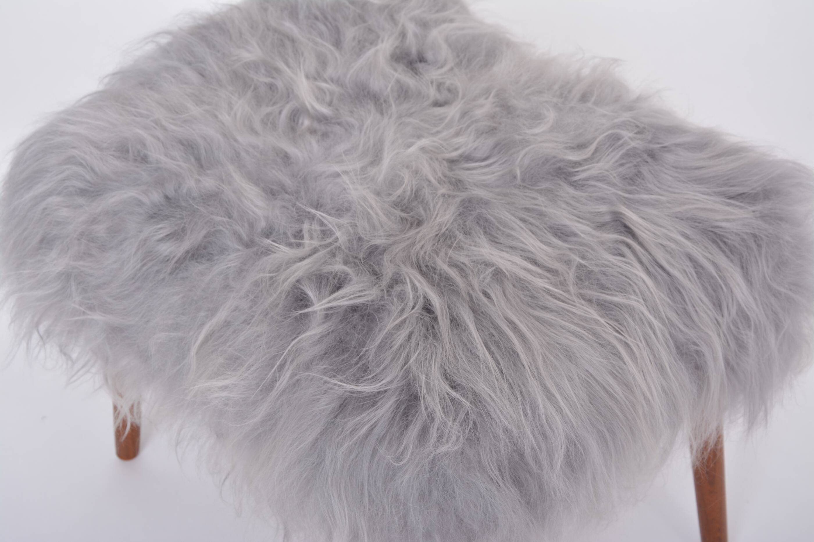 Danish Mid-century Modern stool reupholstered in grey sheep skin