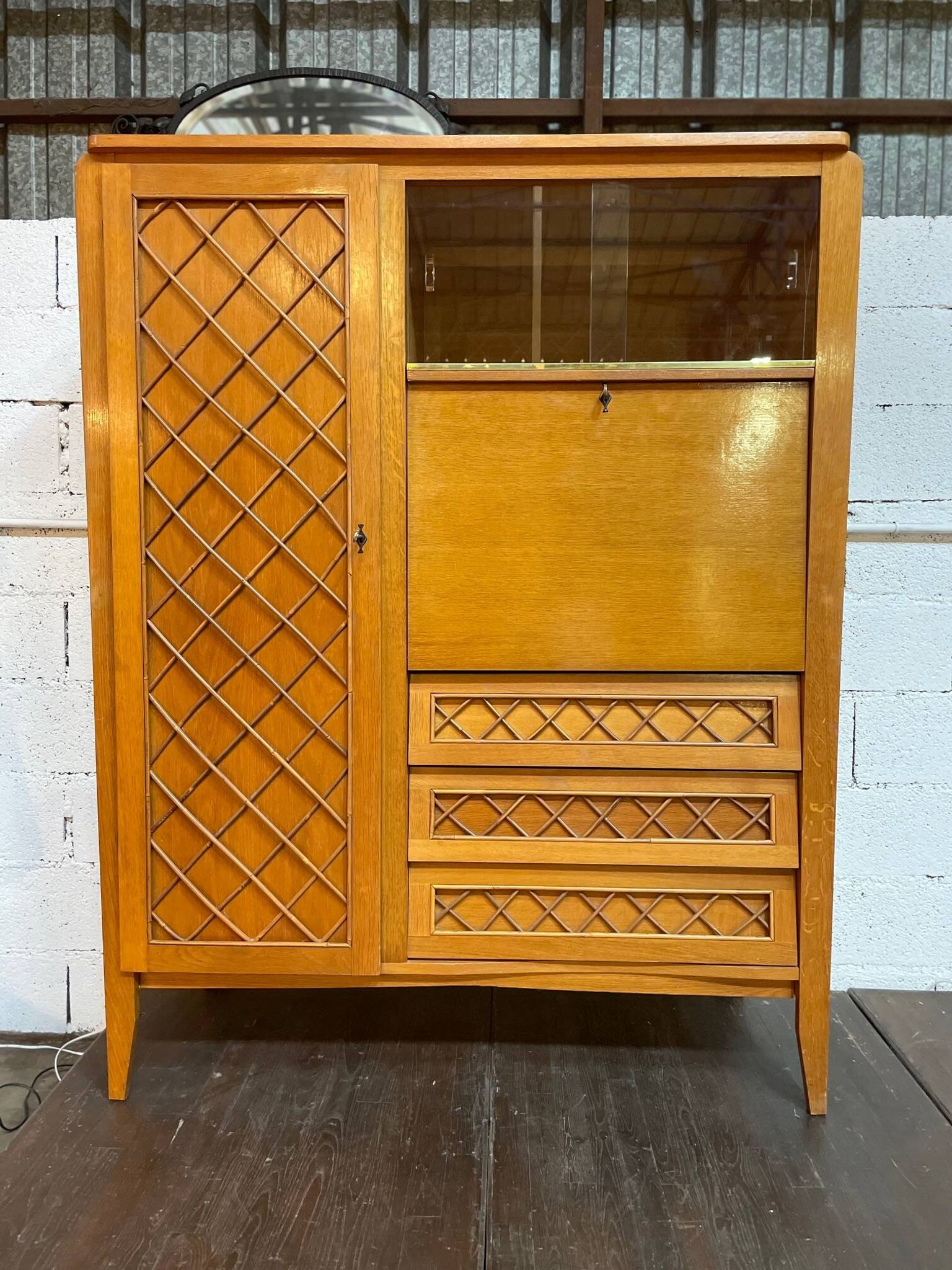 Wardrobe, desk, wooden and rattan chest of drawers, 1960s.
