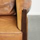 Cognac-coloured Art Deco design armchair made of sheepskin with a high back