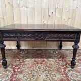 Middle table in a sculpted Louis XIII style living room.