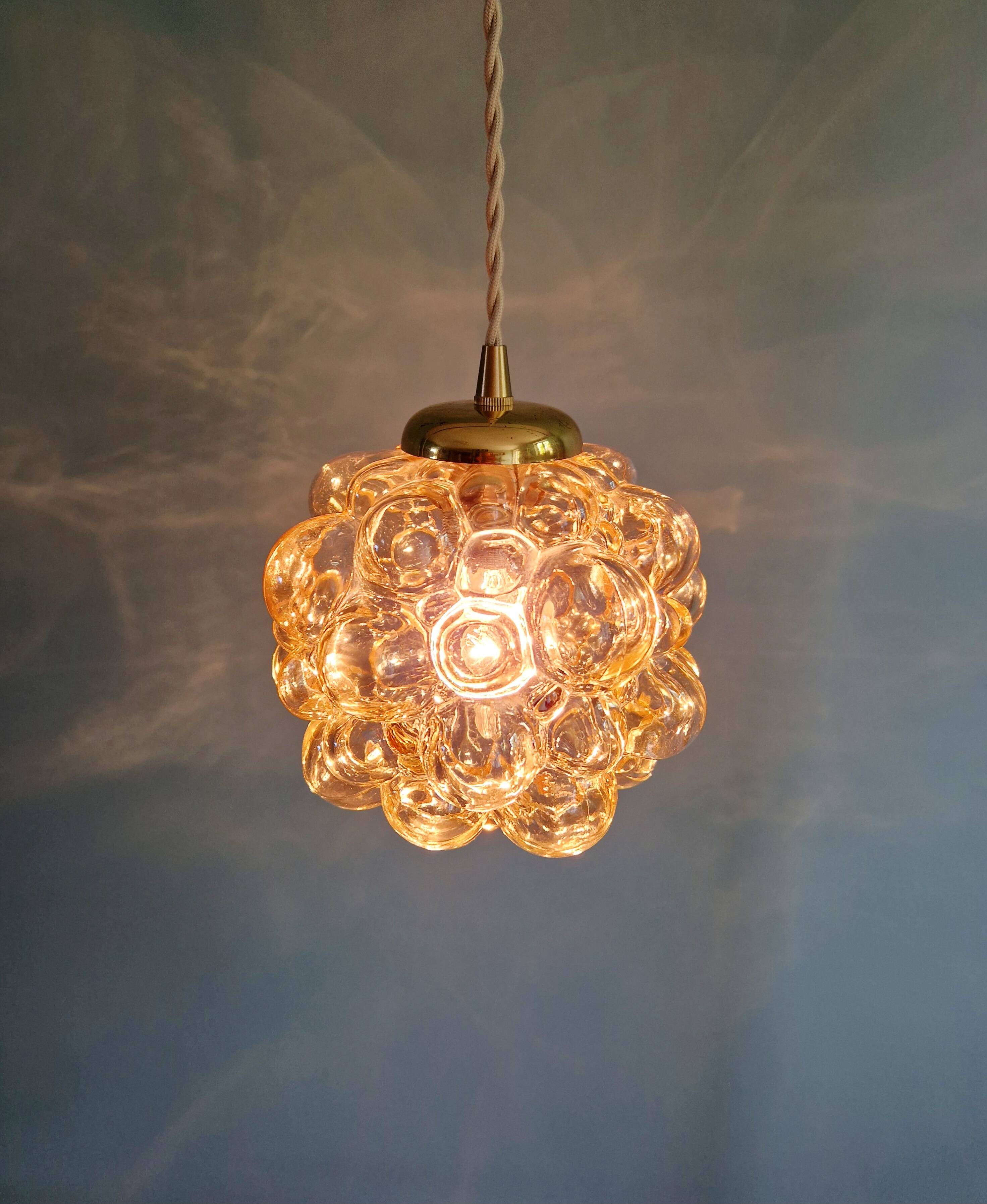 Amber bubble glass pendant (3 available), design by Helena Tynell, 1970.