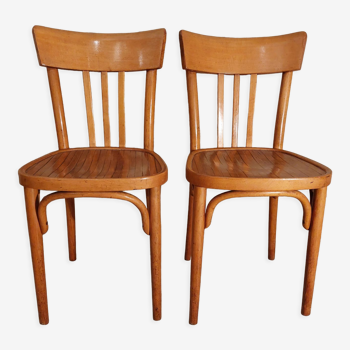 Pair of honey-colored bistro chairs