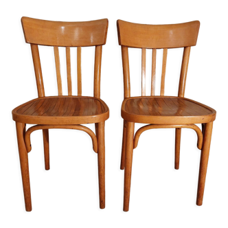 Pair of honey-colored bistro chairs