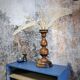 Table lamp, turned wooden foot, 8 rattan petals and golden mesh