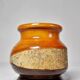 Small turned wooden vase, Brutalist, two-tone varnished with bark